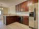 Kitchen with dark wood cabinets and stainless steel appliances at 8138 Brookbend Dr, Douglasville, GA 30134