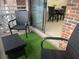 Small patio with artificial turf, wicker chairs, and table at 475 Mount Vernon Ne Hwy, Atlanta, GA 30328