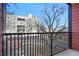 Private balcony overlooking a courtyard with trees at 525 Parkway Ne Dr # 217, Atlanta, GA 30354