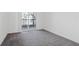 Bright bedroom with grey carpet and private balcony access at 525 Parkway Ne Dr # 217, Atlanta, GA 30308