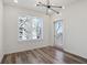 Bright bedroom with hardwood floors and access to a balcony at 525 Parkway Ne Dr # 217, Atlanta, GA 30308