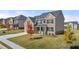 Two-story home with stone accents and a front porch at 999 Blue Juniper Cir, Loganville, GA 30052