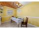 Kitchen dining area with yellow walls and wood ceiling at 282 Evelyn Nw St, Marietta, GA 30064