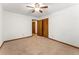 Bright bedroom featuring ceiling fan and ample closet space at 4310 Cochran Mill Rd, Fairburn, GA 30213