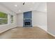 Open living room featuring a blue stone fireplace and LVP flooring at 53 Winn Cir, Lawrenceville, GA 30044