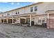 Community backyard view of townhomes with patios at 5586 Rockfern Dr, Lilburn, GA 30047