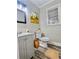 Small bathroom with gray vanity and wood-look floor at 4449 Inns Brook Dr, Snellville, GA 30039