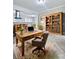 Rustic home office with large desk and bookcases at 4449 Inns Brook Dr, Snellville, GA 30039