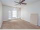 Well-lit bedroom featuring an arched window and ceiling fan at 3103 Snapfinger Ln, Decatur, GA 30034