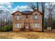 Brick two-story house with a large yard at 3103 Snapfinger Ln, Decatur, GA 30034