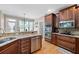 Kitchen with granite countertops and wood cabinets at 416 Telfair Way, Canton, GA 30115