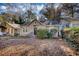 Tan house with landscaping and a yard at 1406 Mozley Pl, Atlanta, GA 30314