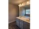 Double vanity bathroom with large mirror and grey cabinets at 2822 Saratoga Lake Vw, Decatur, GA 30034