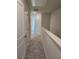 Upstairs hallway with neutral carpeting and doors to bedrooms at 2822 Saratoga Lake Vw, Decatur, GA 30034