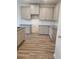 Modern kitchen featuring gray cabinets and granite countertops at 2822 Saratoga Lake Vw, Decatur, GA 30034