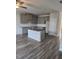 Modern kitchen with gray cabinets, granite counters, and an island at 2822 Saratoga Lake Vw, Decatur, GA 30034