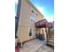 Tan house exterior with a deck and stairs leading to backyard at 1418 Brookside Manor Ct, Tucker, GA 30084