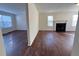 Open living room with hardwood floors and fireplace at 1418 Brookside Manor Ct, Tucker, GA 30084