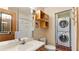 Clean bathroom with stackable washer and dryer at 4184 Brandon Ridge Ne Dr, Marietta, GA 30066