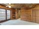 Bright bonus room with wood walls, vaulted ceiling, and built-in shelving at 4184 Brandon Ridge Ne Dr, Marietta, GA 30066