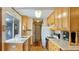 Galley kitchen boasts light wood cabinets and white countertops at 4184 Brandon Ridge Ne Dr, Marietta, GA 30066