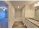 Bathroom with garden tub, double vanity, and wood-look tile floor at 80 Heyman Dr, Covington, GA 30016