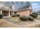 Brick home with walkway and lush landscaping at 133 Barrington Farms Dr, Sharpsburg, GA 30277