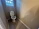 Small half bathroom with toilet at 2250 Rosewood Mill Ct, Loganville, GA 30052