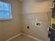 Laundry room with built-in shelving and a water heater at 2250 Rosewood Mill Ct, Loganville, GA 30052