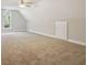 Spacious bonus room featuring carpet, window, and ample storage at 1190 Lake Stone Lea Dr, Oxford, GA 30054