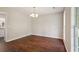 Spacious dining room featuring hardwood floors and natural light at 1190 Lake Stone Lea Dr, Oxford, GA 30054