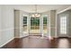 Dining area with bay window and hardwood floors, offering abundant natural light at 1190 Lake Stone Lea Dr, Oxford, GA 30054