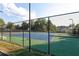 Two well-maintained tennis courts with chain link fencing at 1731 Silverchase Sw, Marietta, GA 30008