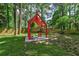 Relaxing backyard with a modern red pergola at 3348 Lynnray Dr, Atlanta, GA 30340