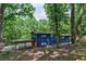 Ranch style blue house on a wooded lot at 3348 Lynnray Dr, Atlanta, GA 30340