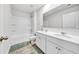 Clean bathroom with double vanity, tub shower, and tile floor at 4929 Calgary Dr, Douglasville, GA 30135