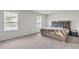 Bright bedroom with plush carpet and large windows at 4929 Calgary Dr, Douglasville, GA 30135