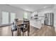 Dining area with table and chairs, and view of kitchen at 4929 Calgary Dr, Douglasville, GA 30135