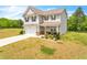 Two-story house with attached garage and landscaped front yard at 4929 Calgary Dr, Douglasville, GA 30135