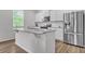 Kitchen island with granite countertops and stainless steel appliances at 4929 Calgary Dr, Douglasville, GA 30135