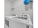 Laundry room with washer, dryer, and overhead shelving at 4929 Calgary Dr, Douglasville, GA 30135