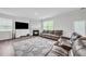 Spacious living room with fireplace and large windows at 4929 Calgary Dr, Douglasville, GA 30135