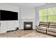 Living room featuring a fireplace and leather couches at 4929 Calgary Dr, Douglasville, GA 30135