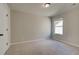 Upstairs bedroom with window and carpet flooring at 2212 Croghan Drive, Hampton, GA 30228