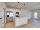 Modern kitchen with white cabinets, stainless steel appliances, and island at 2212 Croghan Drive, Hampton, GA 30228