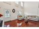 High ceiling living room with hardwood floors and neutral colors at 4130 Brumby Ln, Cumming, GA 30041