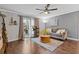 Bright living room with hardwood floors and access to balcony at 725 Dalrymple Rd # 5C, Atlanta, GA 30328