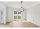 Bright dining room with hardwood floors and a view of the street at 3045 Wyntree Dr, Peachtree Corners, GA 30071