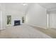 Living room with vaulted ceiling, fireplace, and carpeted floor at 3045 Wyntree Dr, Peachtree Corners, GA 30071