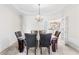 Formal dining room with chandelier and access to kitchen at 3680 Edenbourgh Pl, Marietta, GA 30066